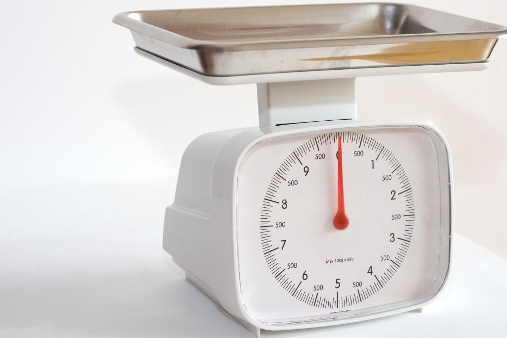 weighing scale on white platform